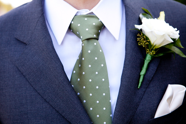 close up of groom's dark gray suit - olive green tie with white polka dots and white rose boutonniere - photo by Seattle based wedding photographers La Vie Photography